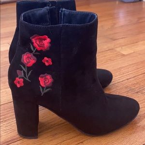Black suede boots with flower detail